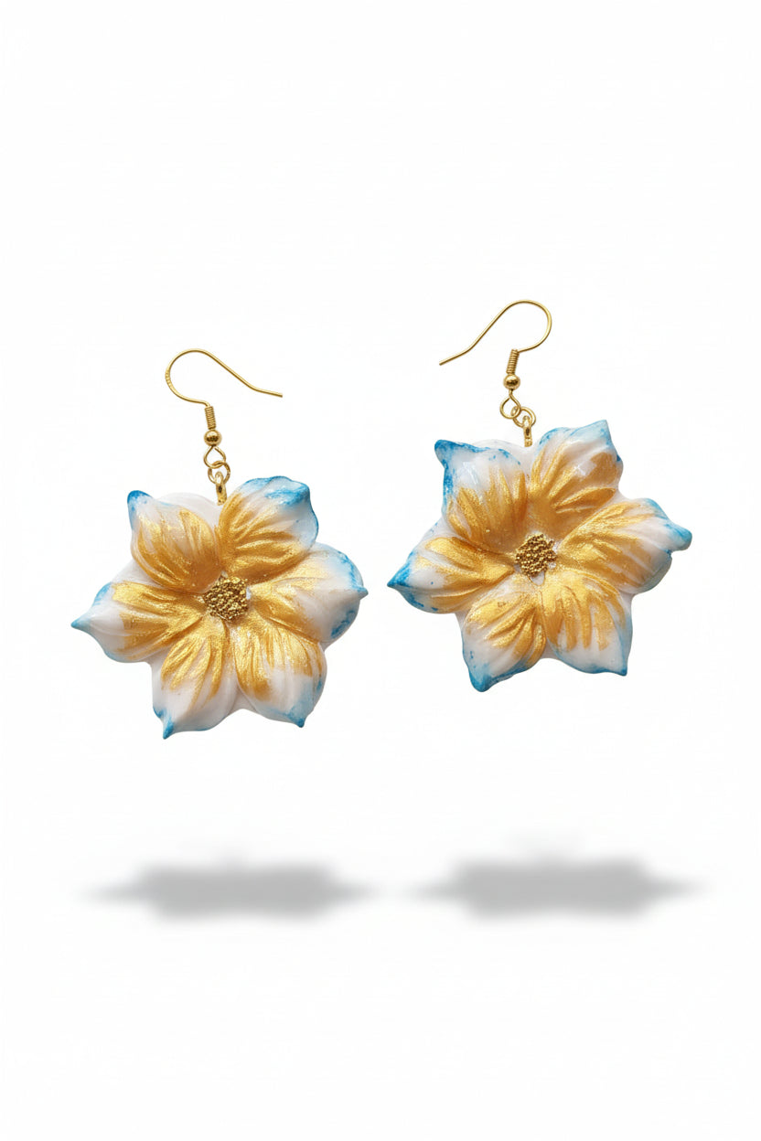 boucles d'oreilles artisanales. Façonnées à la main en argile polymère, elles incarnent l'élégance contemporaine et le savoir-faire artisanal français.