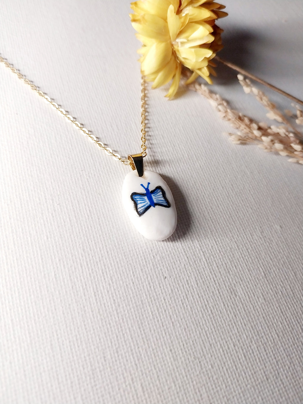 Pendentif bleu et doré papillon Talis&co - argile polymère 