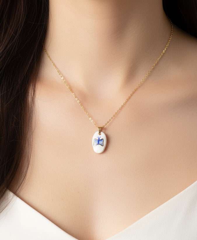 Pendentif bleu et doré papillon Talis&co - argile polymère 