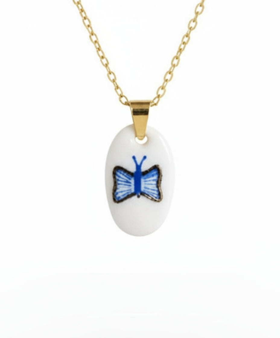 Pendentif bleu et doré papillon Talis&co - argile polymère 