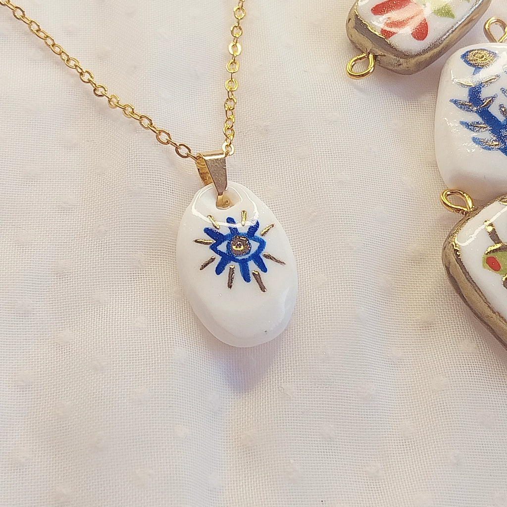 Pendentif bleu et doré Œil protecteur Talis&co - argile polymère 