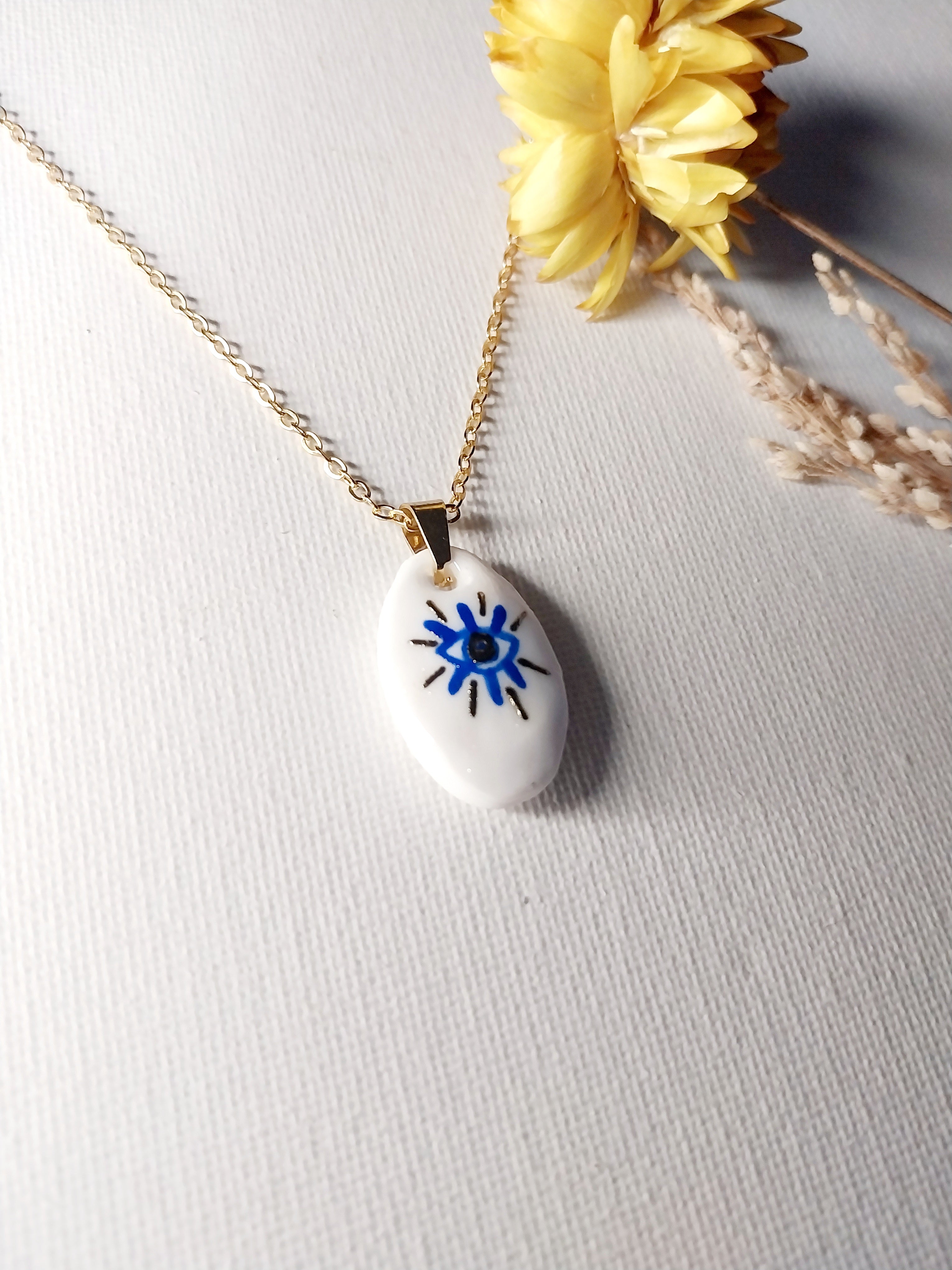 Pendentif bleu et doré Œil protecteur Talis&co - argile polymère 