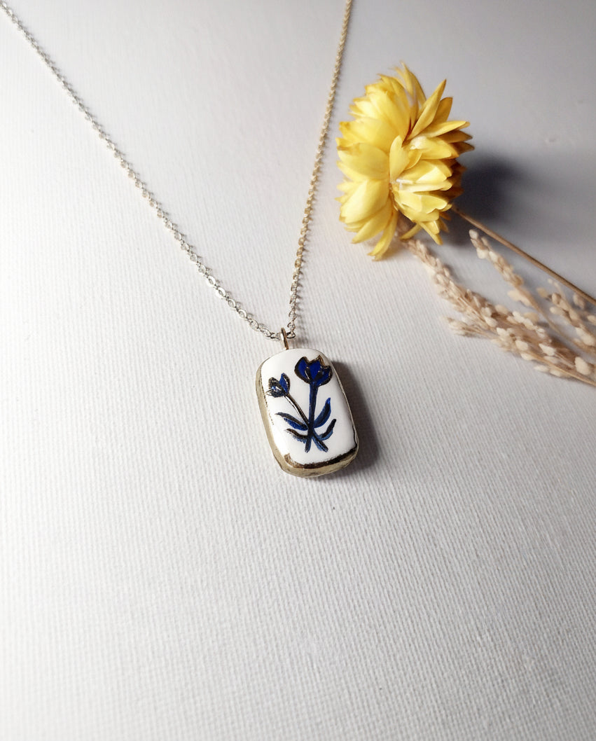 Pendentif fleur bleue et dorée Talis&co