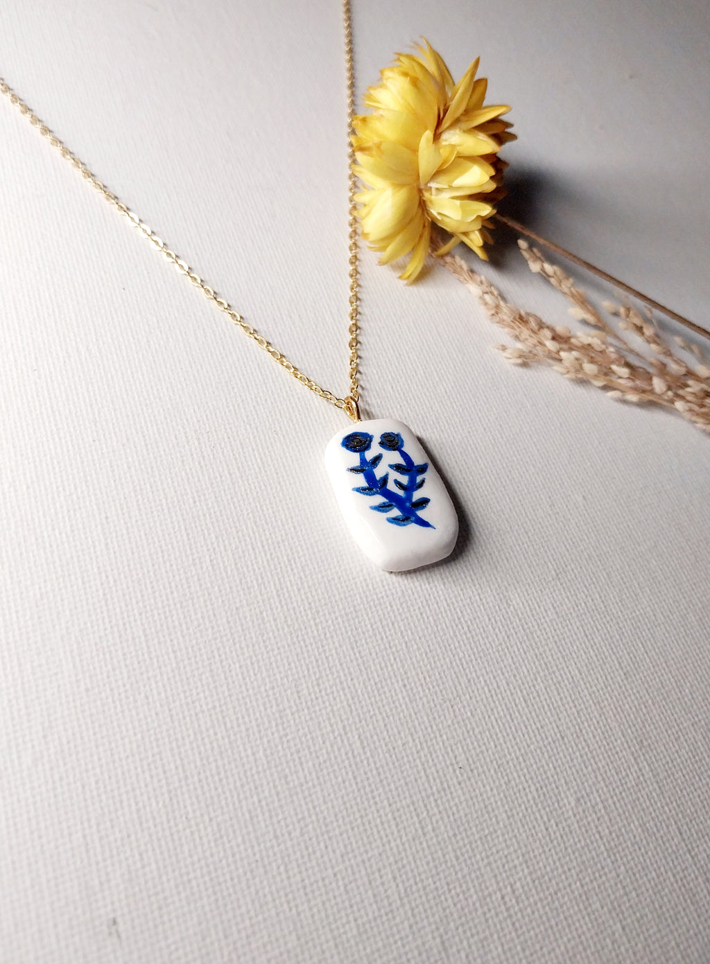 Pendentif fleur bleue et dorée Talis&co